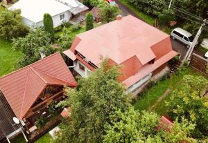 an overhead view of a house with a red roof at ЛІСОВА ХАТИНКА in Kelechin