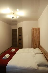 Postel nebo postele na pokoji v ubytování Paramount Kazbegi