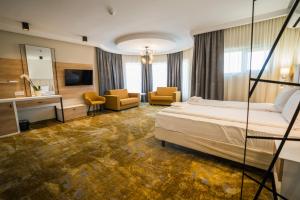 Postel nebo postele na pokoji v ubytování Pensiunea Palace