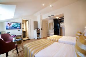 A bed or beds in a room at Icon Hotel Taksim