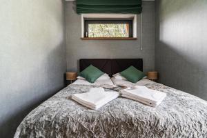 Posteľ alebo postele v izbe v ubytovaní Apartamenty Jedlina