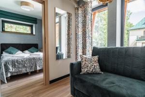 Posteľ alebo postele v izbe v ubytovaní Apartamenty Jedlina