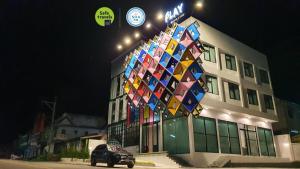 a large building with a lot of lights on top of it at Play Poshtel & Cafe' in Krabi town