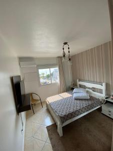 Ліжко або ліжка в номері 202 Apartamento com vista em Bombas