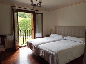 Postel nebo postele na pokoji v ubytování Arregi2 + 8 fotografií