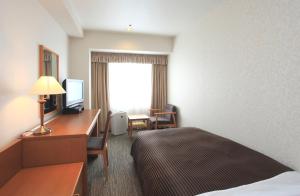 เตียงในห้องที่ Hotel Concorde Hamamatsu