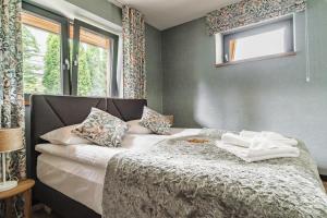 Posteľ alebo postele v izbe v ubytovaní Apartamenty Jedlina