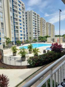 a view of a swimming pool with buildings at Excelente Apartamento Ricaurte, Puerto Azul Torre 10 Apto 208 in Ricaurte