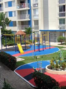 a playground in front of a apartment building at Excelente Apartamento Ricaurte, Puerto Azul Torre 10 Apto 208 in Ricaurte