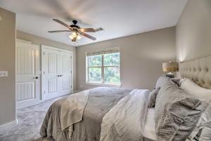 a bedroom with a bed and a ceiling fan at Charming Springdale Townhome about 5 Mi to Dtwn! in Springdale