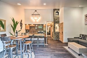 a kitchen and living room with a table and chairs at Lovely Estes Park Escape 1 Mi to National Park! in Estes Park