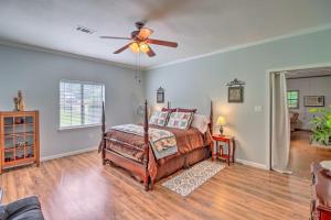 a bedroom with a bed and a ceiling fan at Heavenly Heber Springs Hideaway Fish and Hike! in Heber Springs