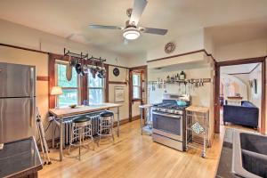 a kitchen with a stove and a refrigerator at Chic Milwaukee Apartment in Hip Neighborhood! in Milwaukee