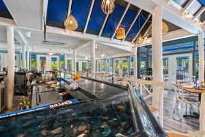 a restaurant with an indoor pool and a bowling alley at NEWLY REMODELED, pool,tennis,5 mins drive 2 beach in Naples
