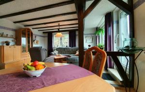 a kitchen with a table with a bowl of fruit on it at FreiRaum in Obersinn