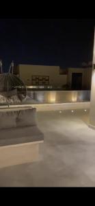 a view of a room with a bed and lights at بنتهاوس ميدتاون ممنوع الزيارات للعزاب in Cairo