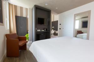 Postel nebo postele na pokoji v ubytování Hotel Al Campanile - Luxury Suites & Apartments