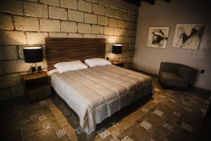 Łóżko lub łóżka w pokoju w obiekcie Real de Corralejo
