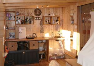 a kitchen with a counter and a sink in a room at Refugio del Lago in Seekirchen am Wallersee