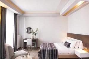 Ένα ή περισσότερα κρεβάτια σε δωμάτιο στο Maison Hotel