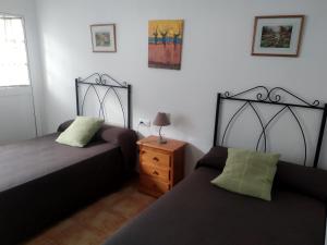 A bed or beds in a room at Alojamientos Andalucia