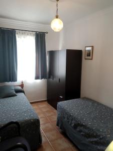 A bed or beds in a room at Alojamientos Andalucia