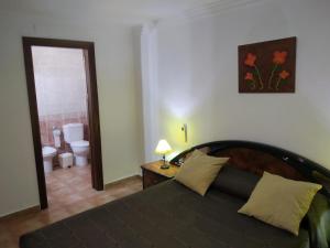 A bed or beds in a room at Alojamientos Andalucia