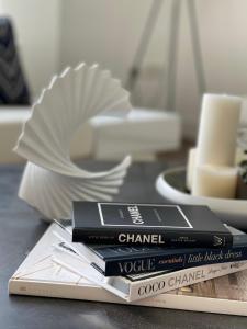 a pile of books sitting on top of a table at Westminster Burj Residences in Dubai