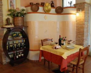 a dining room with a table with a bunch of wine bottles at Locanda Canareggio in San Biagio di Callalta