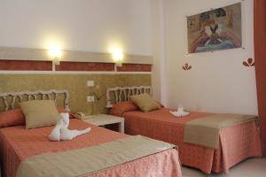 Posteľ alebo postele v izbe v ubytovaní 4Dreams Hotel Chimisay