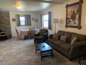 a living room with a couch and a table at Rr-june Lake Lodge in June Lake