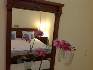 A bed or beds in a room at Florena Hotel