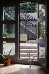 a view from a window of a staircase with a chair at Apartament przy Katedrze in Lublin