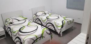 Ένα ή περισσότερα κρεβάτια σε δωμάτιο στο Casa MIMI