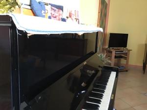 Televízia a/alebo spoločenská miestnosť v ubytovaní La Casa del Sole