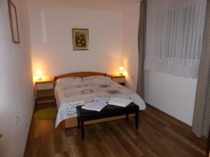 Postel nebo postele na pokoji v ubytování Apartments Toni, Borik