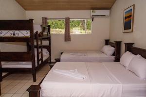 Postel nebo postele na pokoji v ubytování Hotel Don Fito