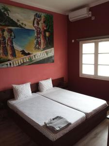 Giường trong phòng chung tại Residencial Avenida Geovanni