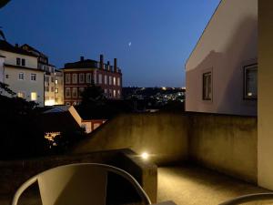 a view of a city at night from a building at SOBRE RIBAS 2|12 in Coimbra