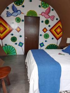 Een bed of bedden in een kamer bij Casa Naiyari