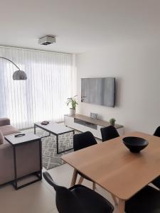 a living room with a table and chairs at Austral 503 in Ushuaia