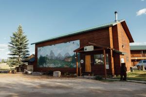 a building with a mural on the side of it at Teton Peaks Resort in Tetonia