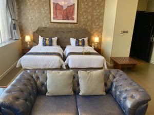 En eller flere senge i et værelse på Al Ahsa Grand Hotel