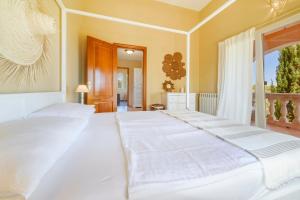 Łóżko lub łóżka w pokoju w obiekcie Villa Turo del Sol