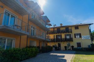 a building with balconies on the side of it at Residence Desiree in Riva del Garda