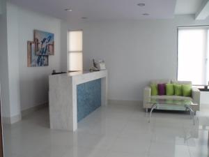 a living room with a couch and a table at Nafsika Hotel in Rhodes Town