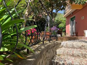 a fence with a bench in front of a house at Albamare in Monterosso al Mare