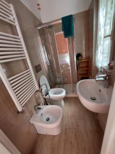 a bathroom with a sink and a toilet and a shower at Albamare in Monterosso al Mare