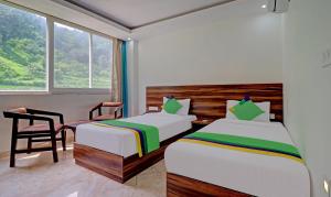 Llit o llits en una habitació de Hotel Hidden Delight Rishikesh