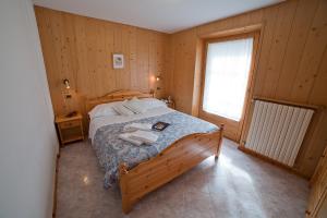 Postel nebo postele na pokoji v ubytování Chalet Bucaneve
